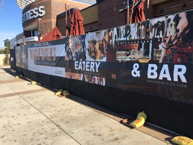 Retail Vinyl Banner Attached to Fence
